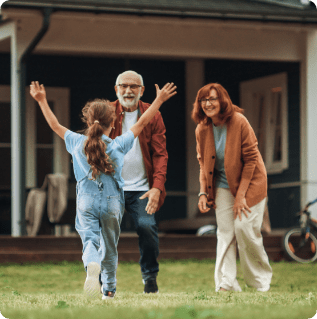 Grandfather and Grandmother are Happy to Meet Their Granddaughter in Front of their Suburbs House. Grandparents Spending the Weekend with Kids, Enjoying Family Time with Grandchild